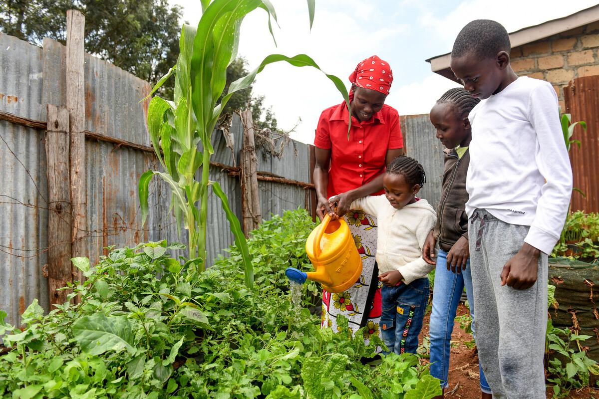 uploads/images/Belinda With Her Children In their Cone Garden Which is At the Nearby offices of Beacon of Hope Photo Credit David Macharia