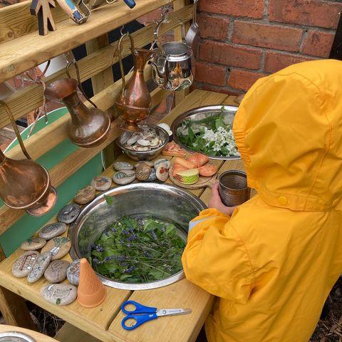 homeplaylearn mud kitchen cutting herbs